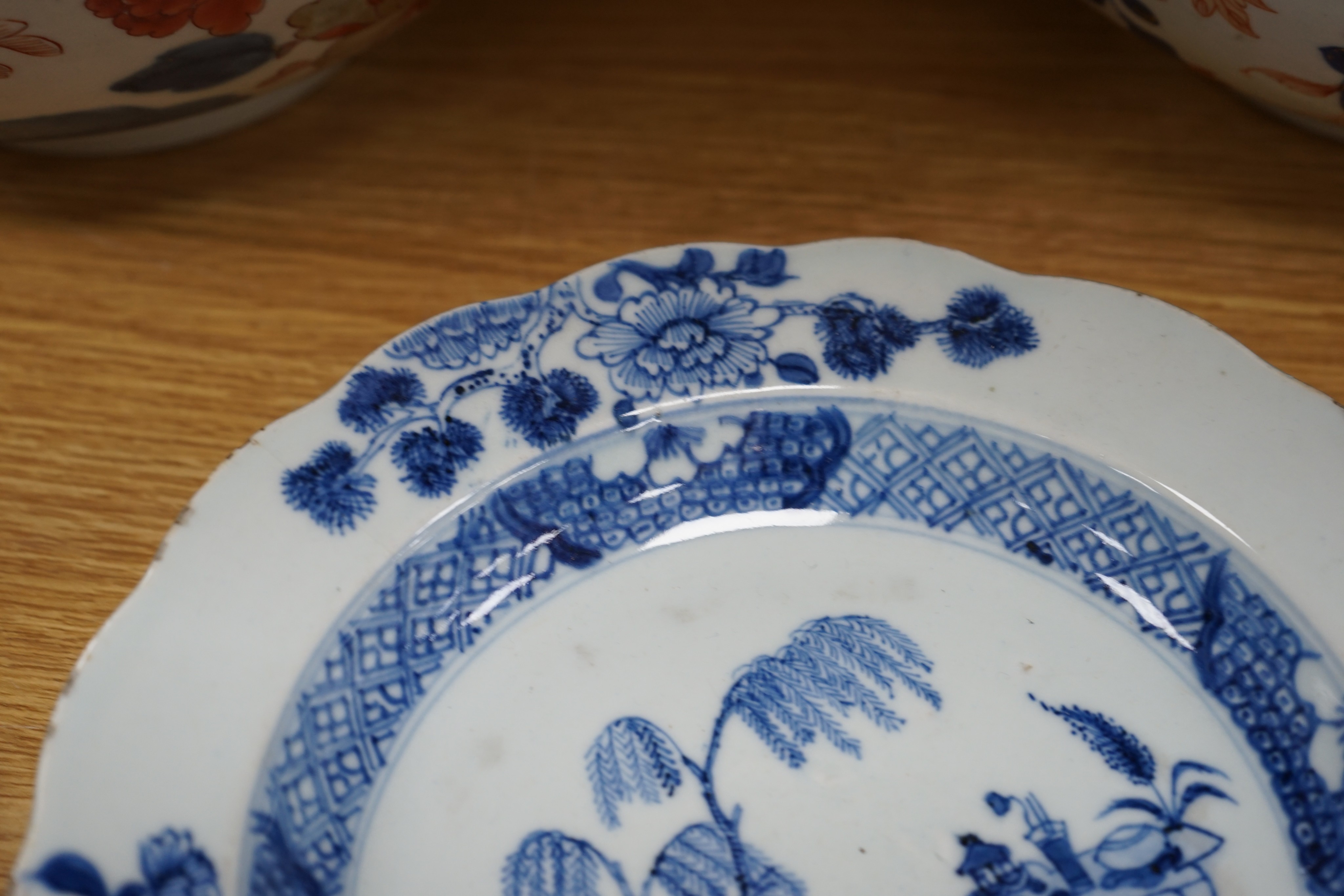 Three 18th century Chinese export porcelain bowls, largest 28 cm and two plates
